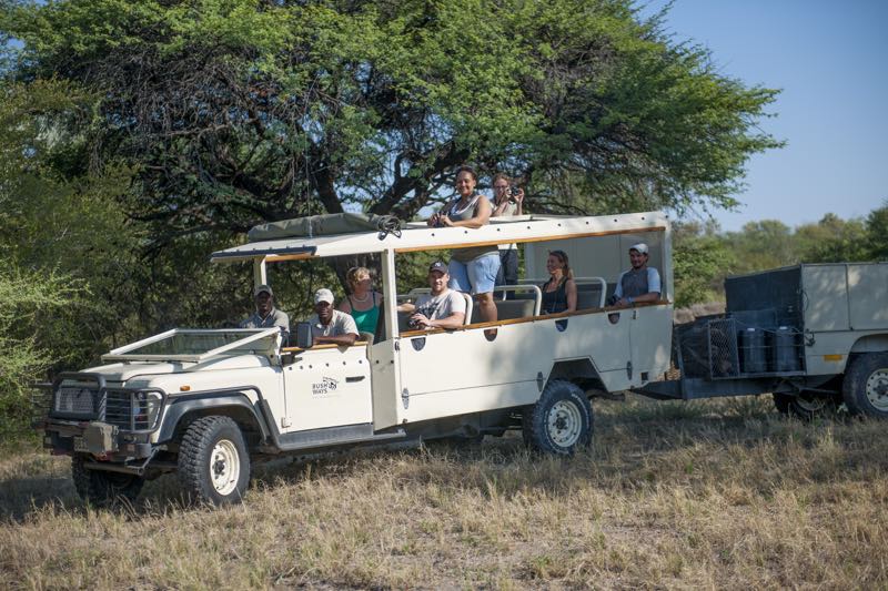 People enjoying ride on Safari Vehicle